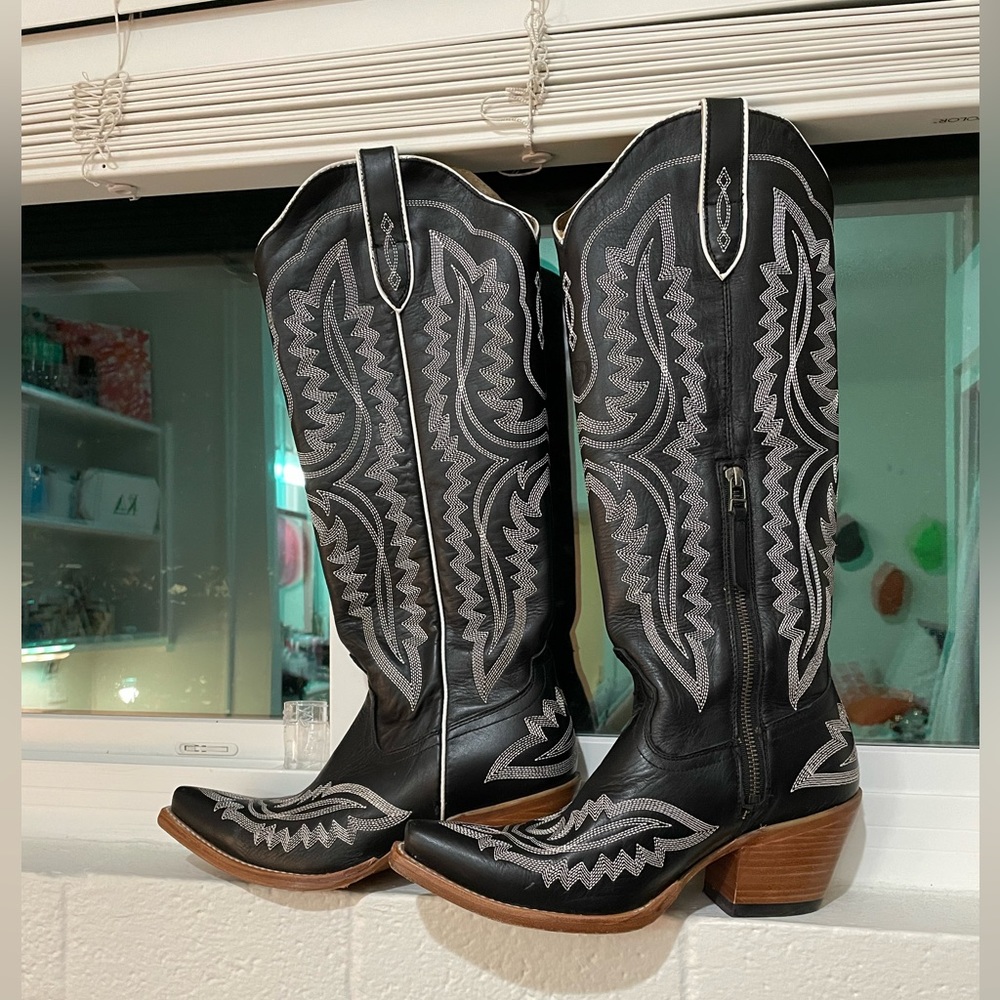 Tall cowboy boots! Worn once, very comfortable and stylish!